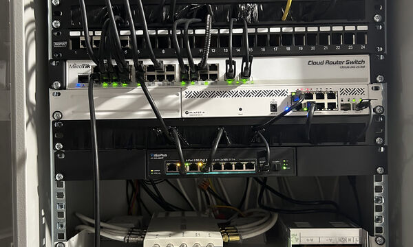 A patch panel and network switches in a rack